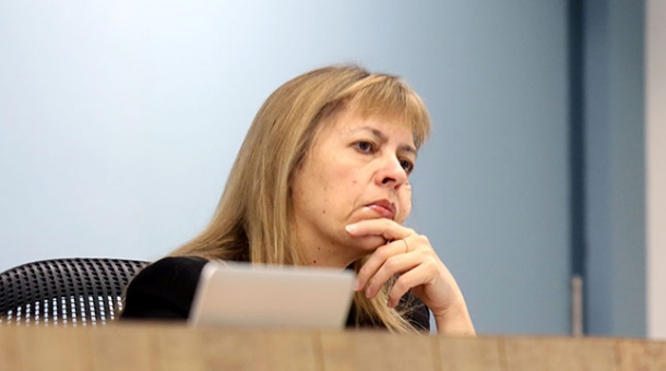 Commissioner Helen Milroy sitting at a bench