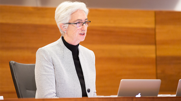 Justice Jennifer Coate sitting at a bench