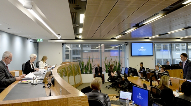 From left to right: Commissioner Bob Atkinson AO APM, Justice Jennifer Coate, Commissioner Helen Milroy and Counsel Assisting, David Lloyd
