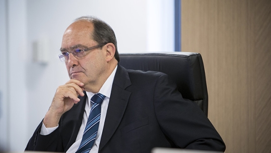 Commissioner Andrew Murray sitting at a bench