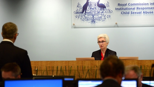 Justice Jennifer Coate addressing Assistant Counsel Simon Beckett