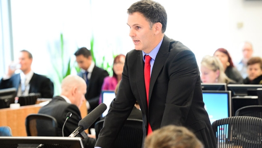 Counsel Assisting, David Lloyd presenting in a hearing room