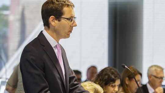 Counsel Assisting, Angus Stewart SC presenting in a hearing room in Hobart