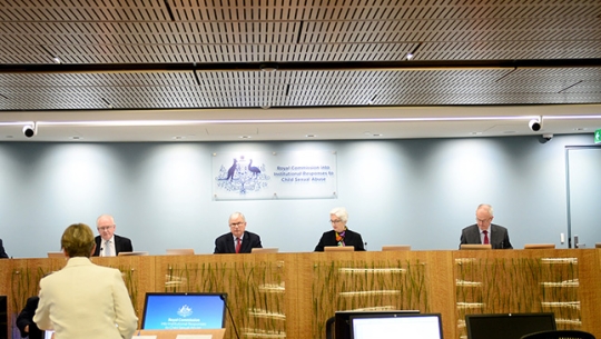 The full bench of Commissioners sitting and listening to Counsel Assisting Gail Furness SC