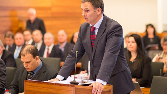 Counsel Assisting, David Lloyd presenting in a hearing room
