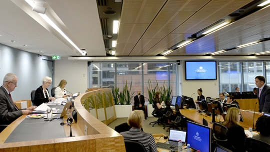 From left to right: Commissioner Bob Atkinson AO APM, Justice Jennifer Coate, Commissioner Helen Milroy and Counsel Assisting, David Lloyd