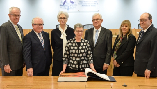 Commissioners and Dr Marie-Louise Ayers, the Director-General of the National Library with the Message to Australia book