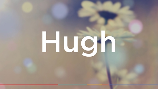 The text 'Hugh' with a blurred floral background